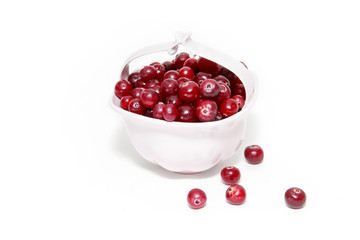 Ripe cranberry on a white background