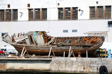 Rusty old boat on a dock. In Rijeka, Croatia. 