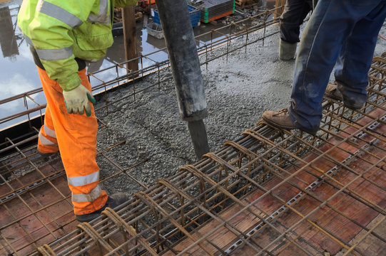 Concreting of slab pouring concrete engineering construction with rebar and formwork