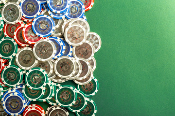 Cards and chips for poker on green table