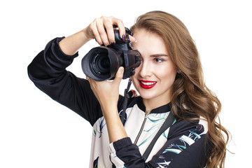 Young cheerful woman taking a picture over white background