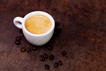 White cup of espresso coffee on background
