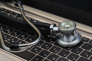 Stethoscope on a computer keyboard