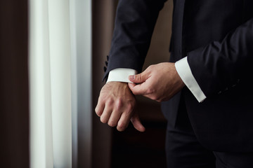 Businessman wears a jacket.Politician, man's style,male hands closeup, American, European businessman, business, fashion and clothing concept