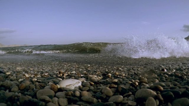 wave washes up to the shore slow motion