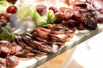 reach of the kitchen of typical Italian cold cuts, pork: salciccia , prosciutto , salami