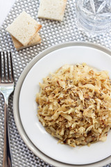 Fried cabbage with caraway and garlic on a plate