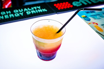 Mixed cocktail on a white light background. Club party entertainment.