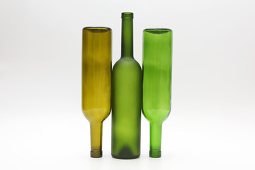 three empty bottles of wine on white background