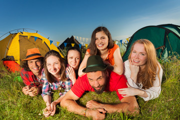 Funny young people enjoying with camping trip