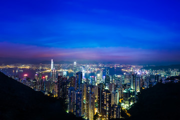 Fototapeta premium Night aerial view panorama of Hong Kong skyline and Victoria Harbor. Travel destinations