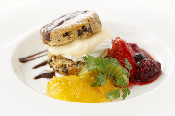 Creamy bread with orange and strawberry jam