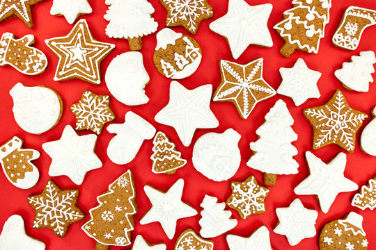 holiday background with various christmas gingerbread cookies on red