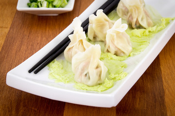 Steamed pork dumplings on plate closeup