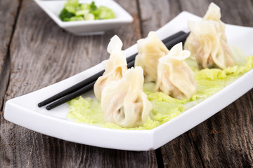 Steamed pork dumplings on plate closeup