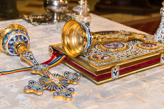 The Bible and cross in the Orthodox Church prepared for baptism ceremony in the Romanian Church