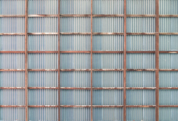 Wood frame ceiling with old rusty zinc roof, background
