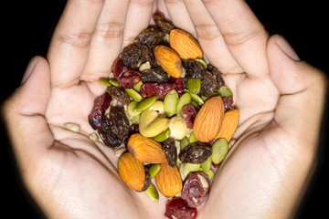 Trail mix on the hand.