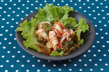 Fried spicy mixed herb  with squid and lettuce
