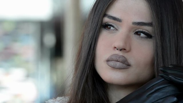 Woman with gloves and unique fleshy lips 