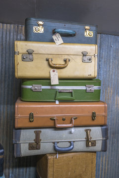 Vintage Suitcases I 1950s-60s / Vintage used suitcases stacked for sale. 