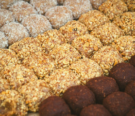 Colorful healthy homemade candies with nuts, dry fruits and spices