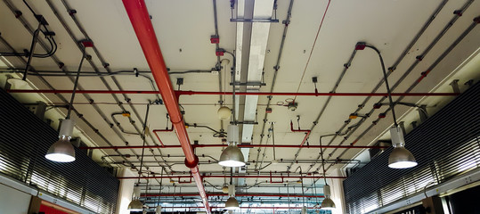 Bare skin ceiling; show  lighting design, electrical system and fire protection system.