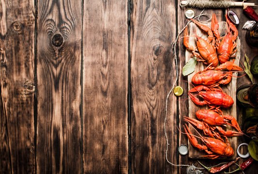 oiled crawfish with beer bottles on the old Board.