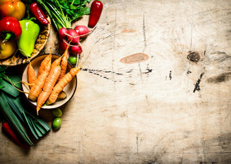 Fresh vegetables on wooden table.