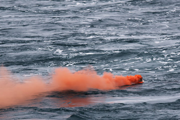 orange smoke on the water