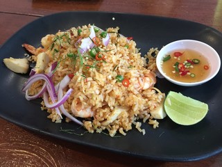 Shrimp tom yam fired rice on black dish