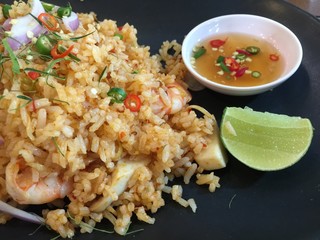 Shrimp tom yam fired rice on black dish