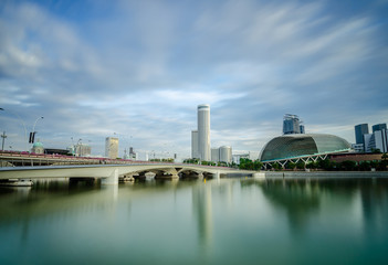 Fototapeta premium Beautiful morning at Marina Bay with The Esplanade. The Esplanade consists of a concert hall and a theatre with a capacity of about 3800 seats in total.