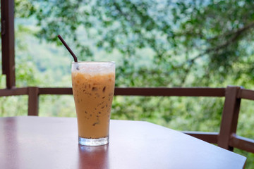 Iced coffee in coffee shop with natural background