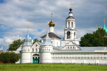 Fototapeta na wymiar Holy Gates and St. Nicholas Church in the Holy Vvedensky Tolgsky convent, cloudy day in july. Yaroslavl, Golden Ring of Russia