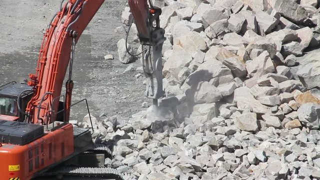 Big red excavator on construction site