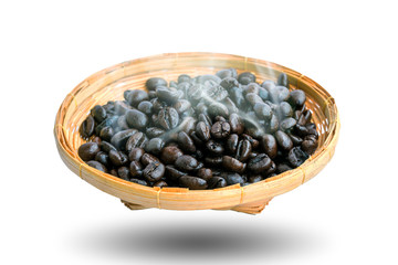 Hot coffee beans in the bamboo plate isolated on white background.