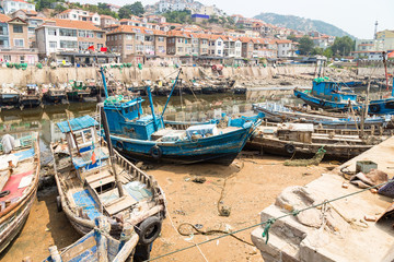 Fototapeta na wymiar Wooden fishing boats in the village of Shazikou, in the outskirts of Qingdao, Shandong, China