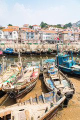 Wooden fishing boats in the village of Shazikou, in the outskirts of Qingdao, Shandong, China