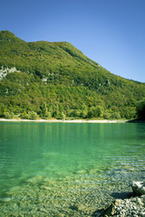 Fototapeta na wymiar Lago di Tenno - turquoise lake in Italian Alps