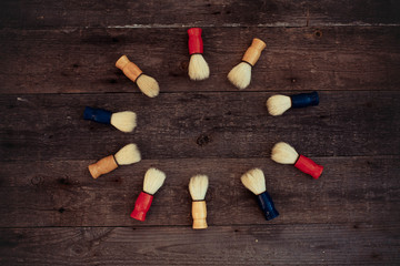 Shaving brush on a wooden background