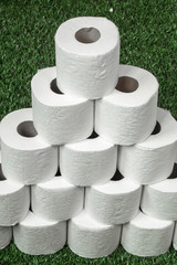 White toilet paper on green grass