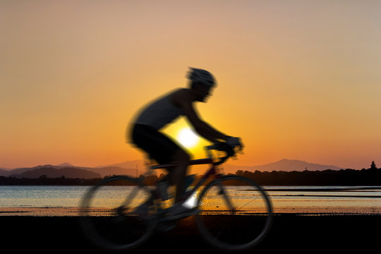 Cycling at beach on twilight