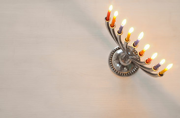 Top view of jewish holiday Hanukkah with menorah © tomertu