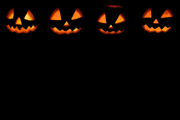 four halloween pumpkins background
