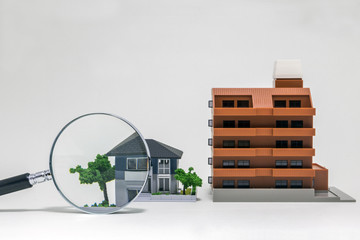 house, apartment building and magnifying glass, searching or checking concept