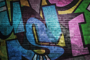 Obraz premium Colorful graffiti letters on brick wall background