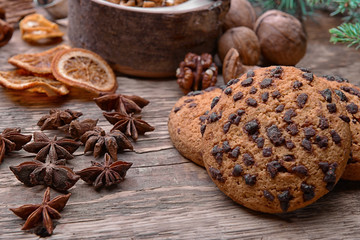 Tasty cookies and anise on wooden background, close up view