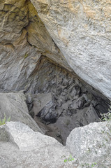 The black cave. Old and primitive shelter formed over the bedrock of mountain. It's located in Montanejos, inside the region of Castellon (Spain)