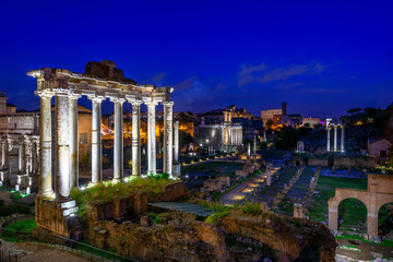 Night view of Temple of Saturn and Forum Romanum in Rome, Italy